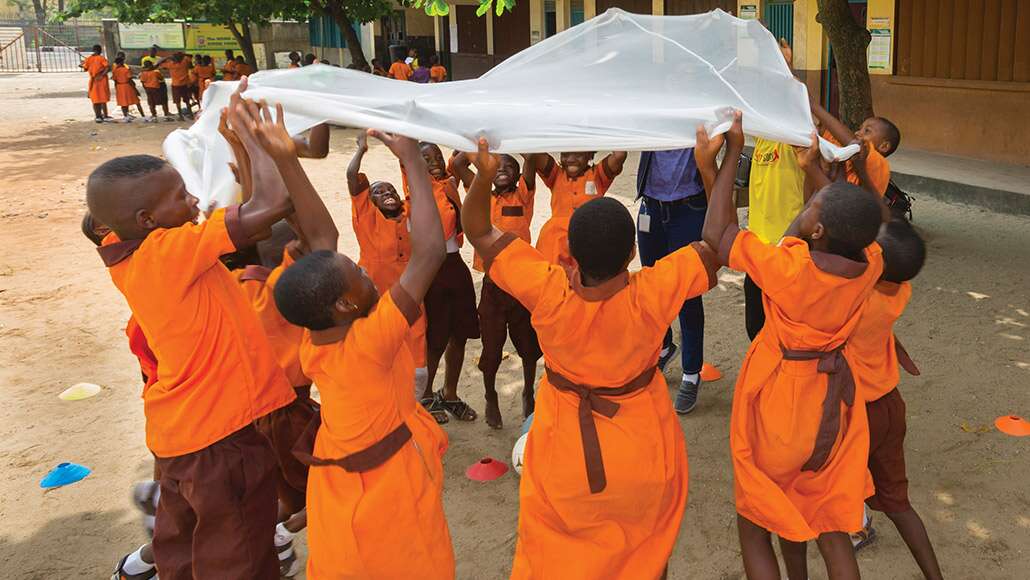 children with mosquito netting