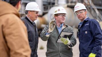 Group of employees in hard hats