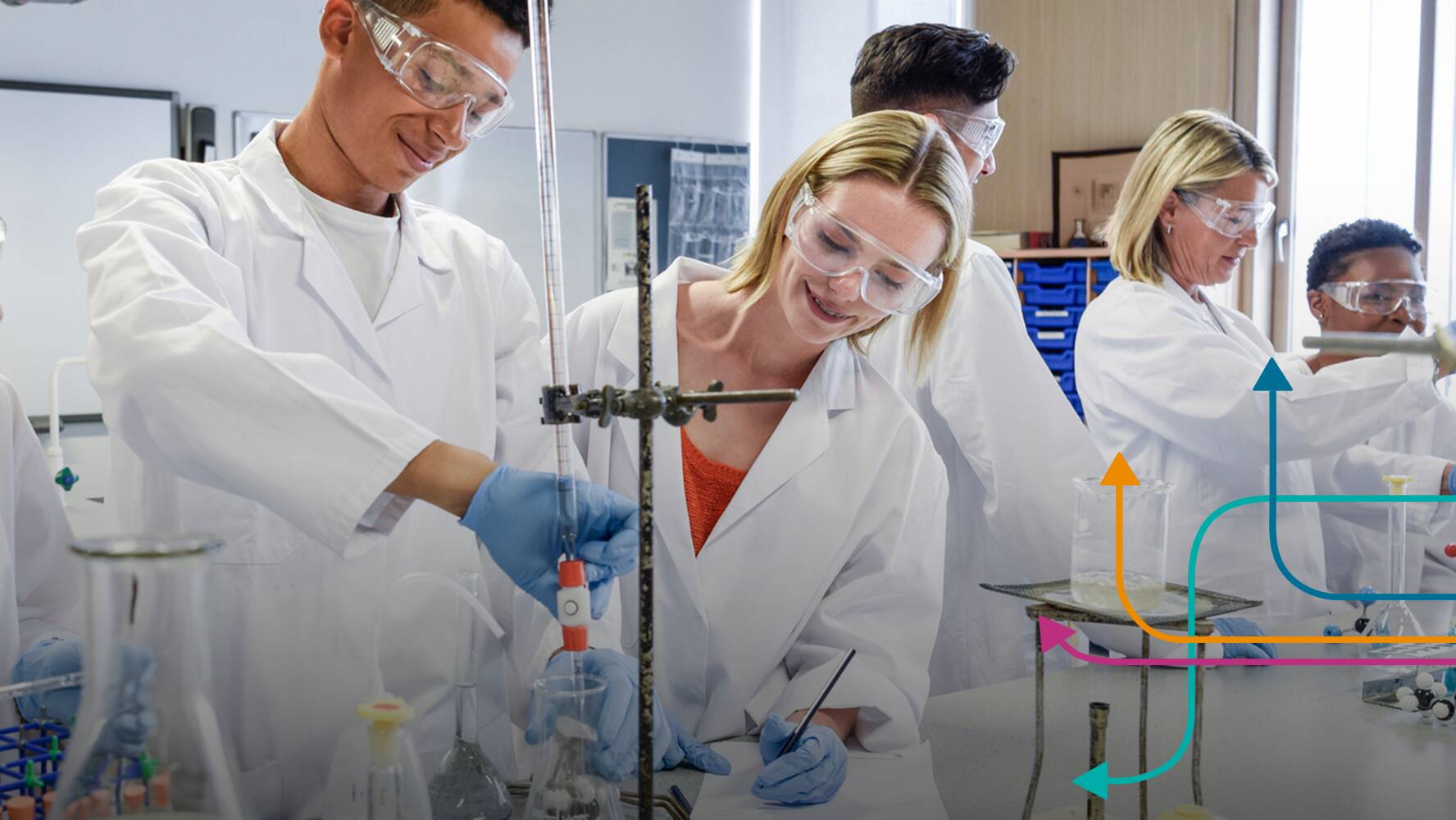 Teachers and students working together in science lab