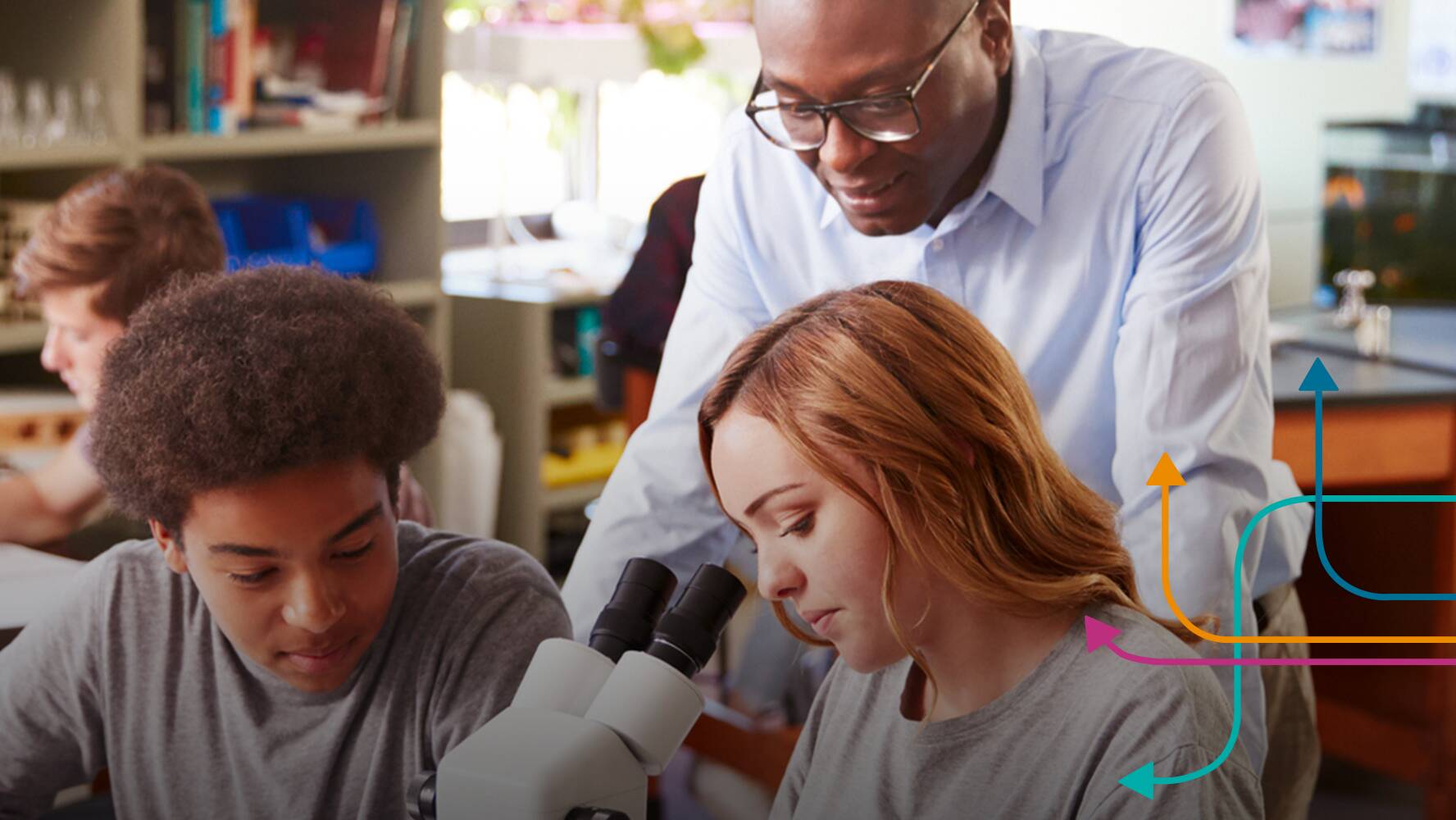 Teachers and students working together in science lab