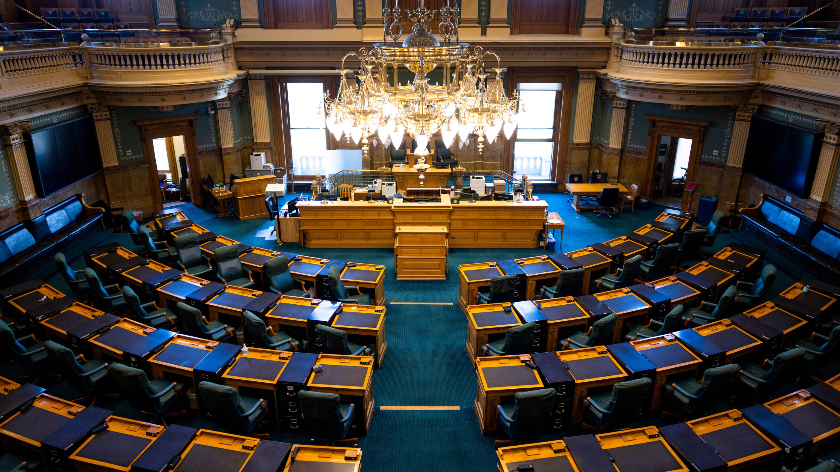 State congress room with chairs and desks in a half circle.