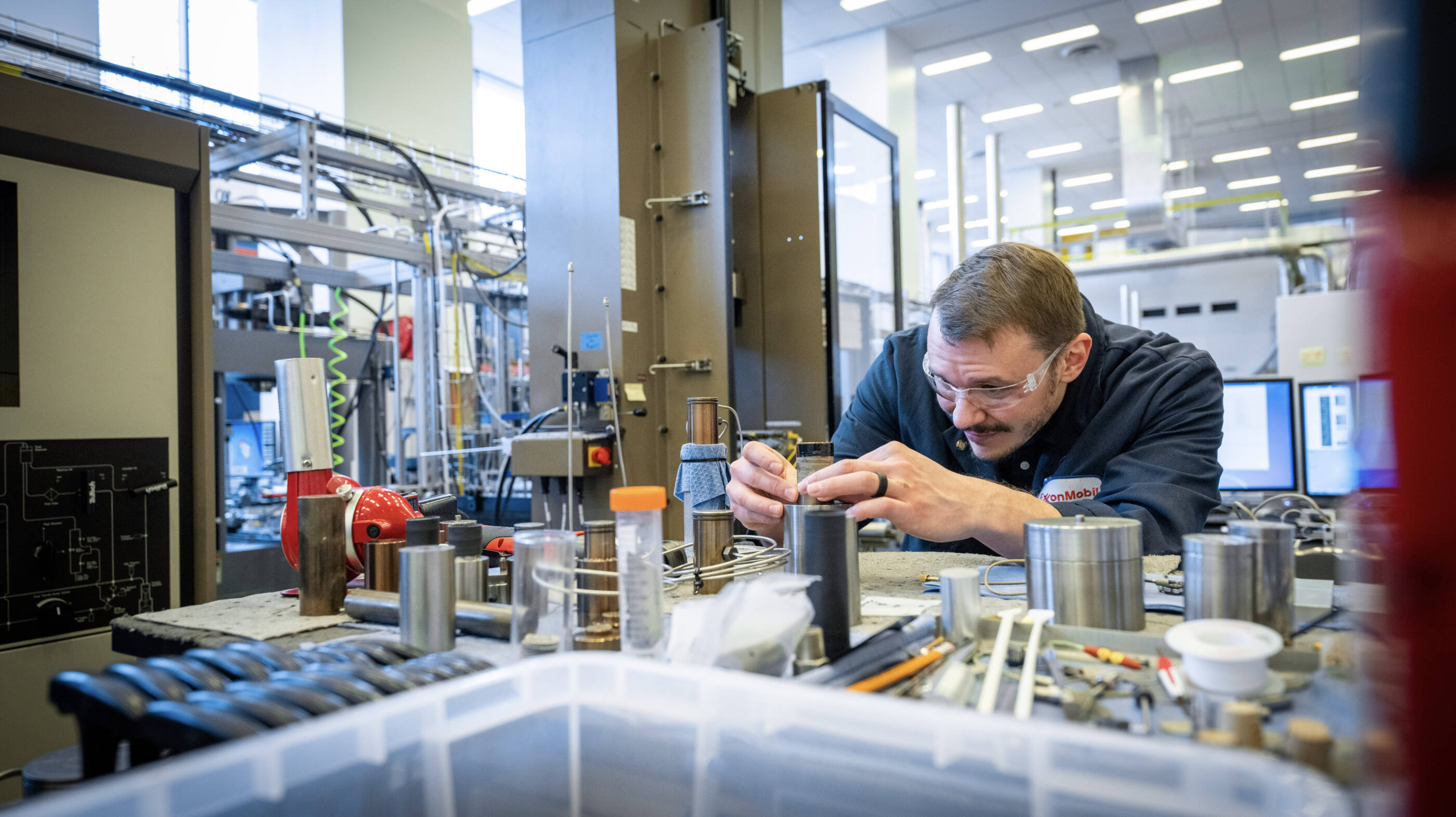 ExxonMobil employee working in a mechanical lab.