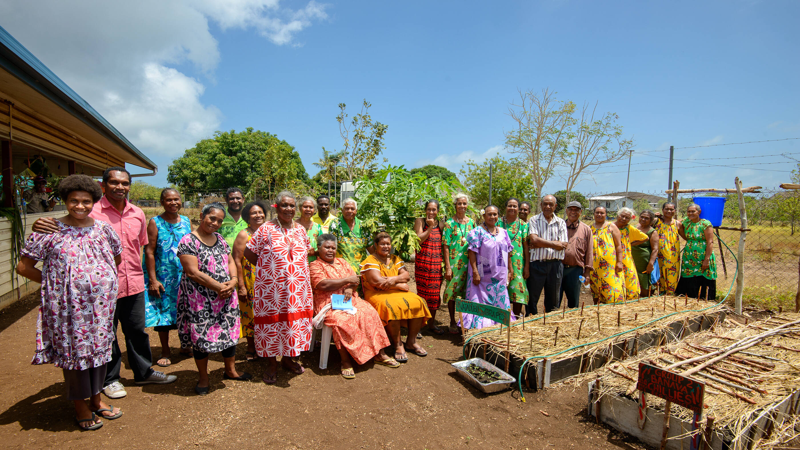 Farmers and their families posing for a picture.