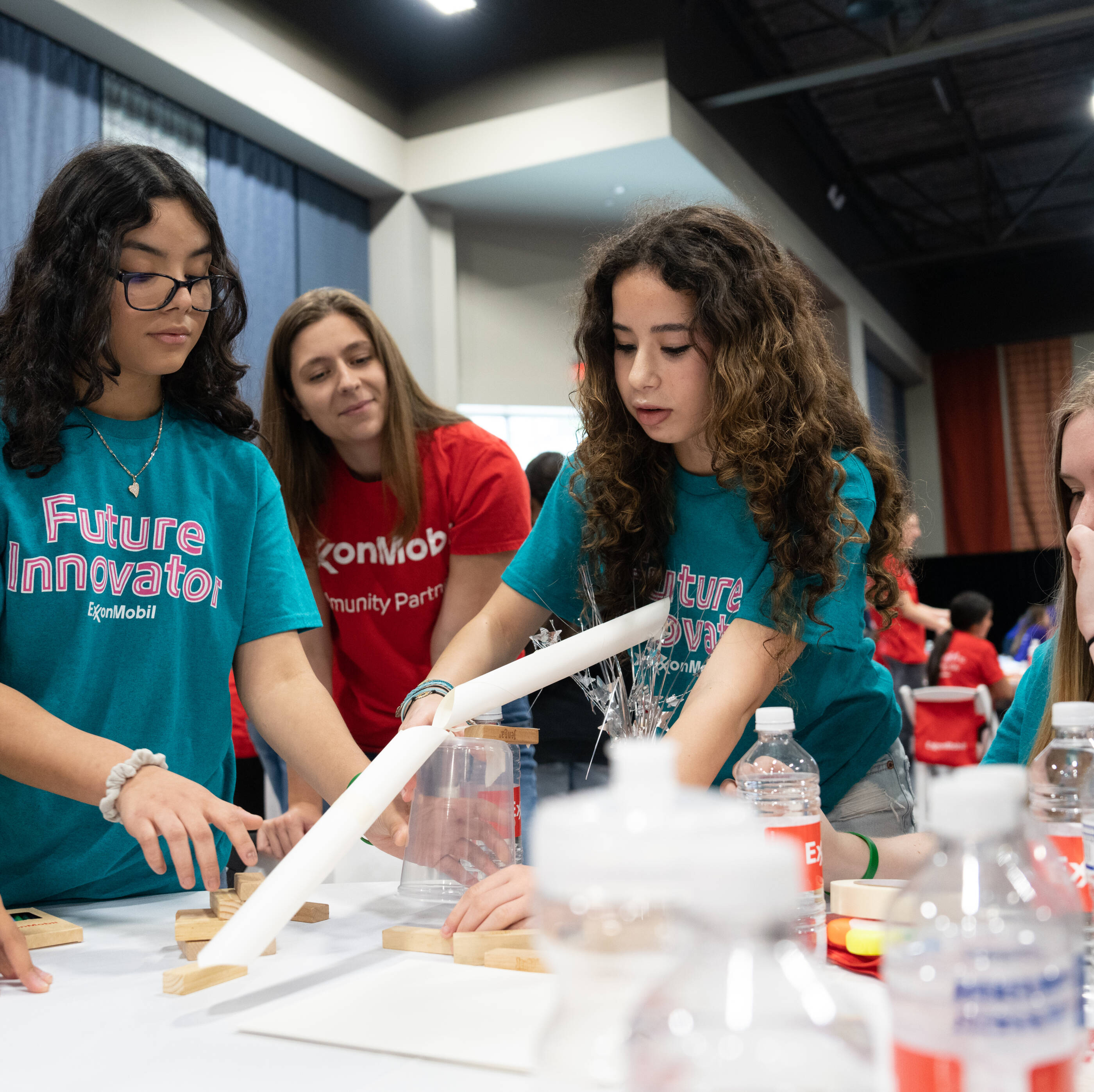 Students working with ExxonMobil on a project.