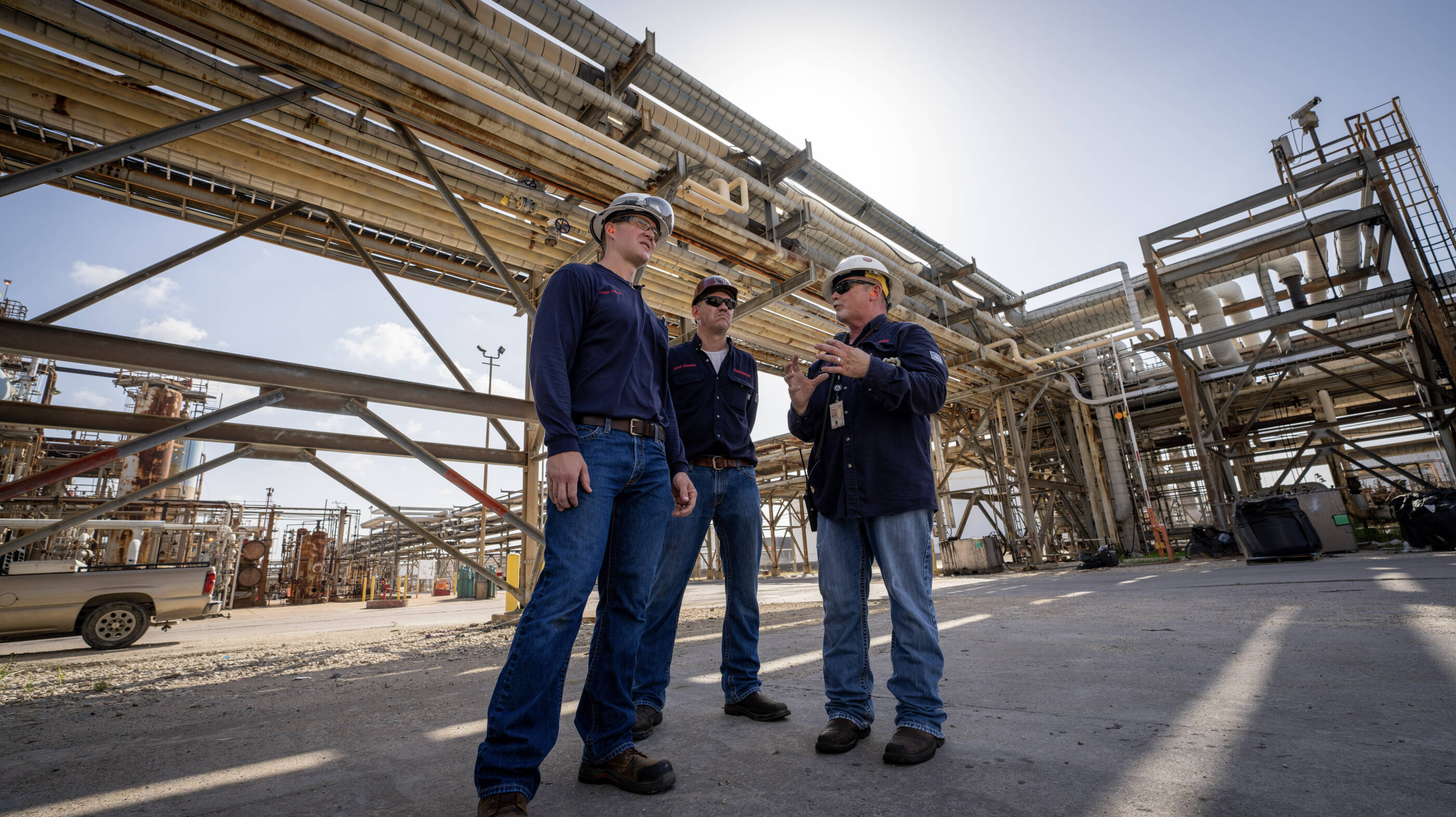 ExxonMobil employees working around an oil rig.