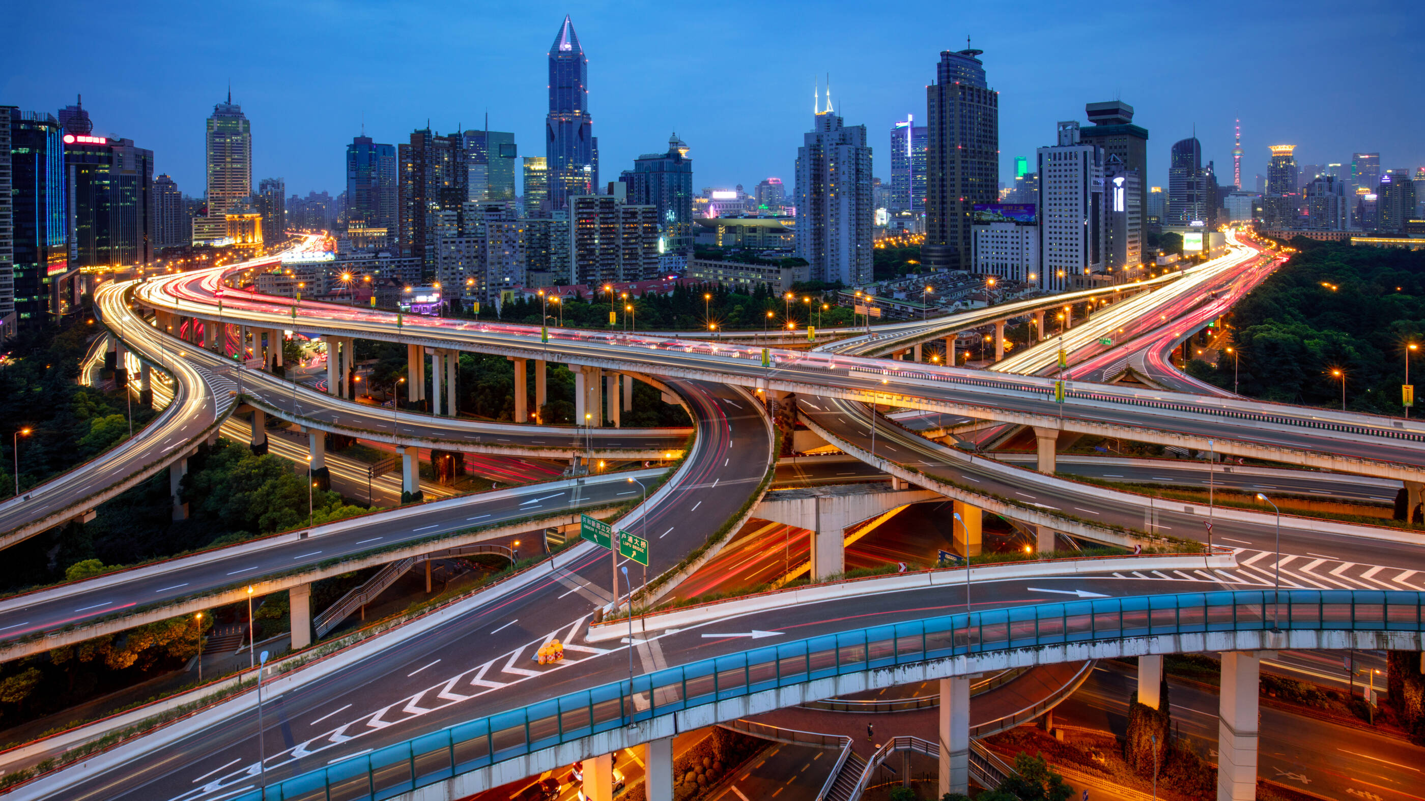 skyline with major roadways at dusk