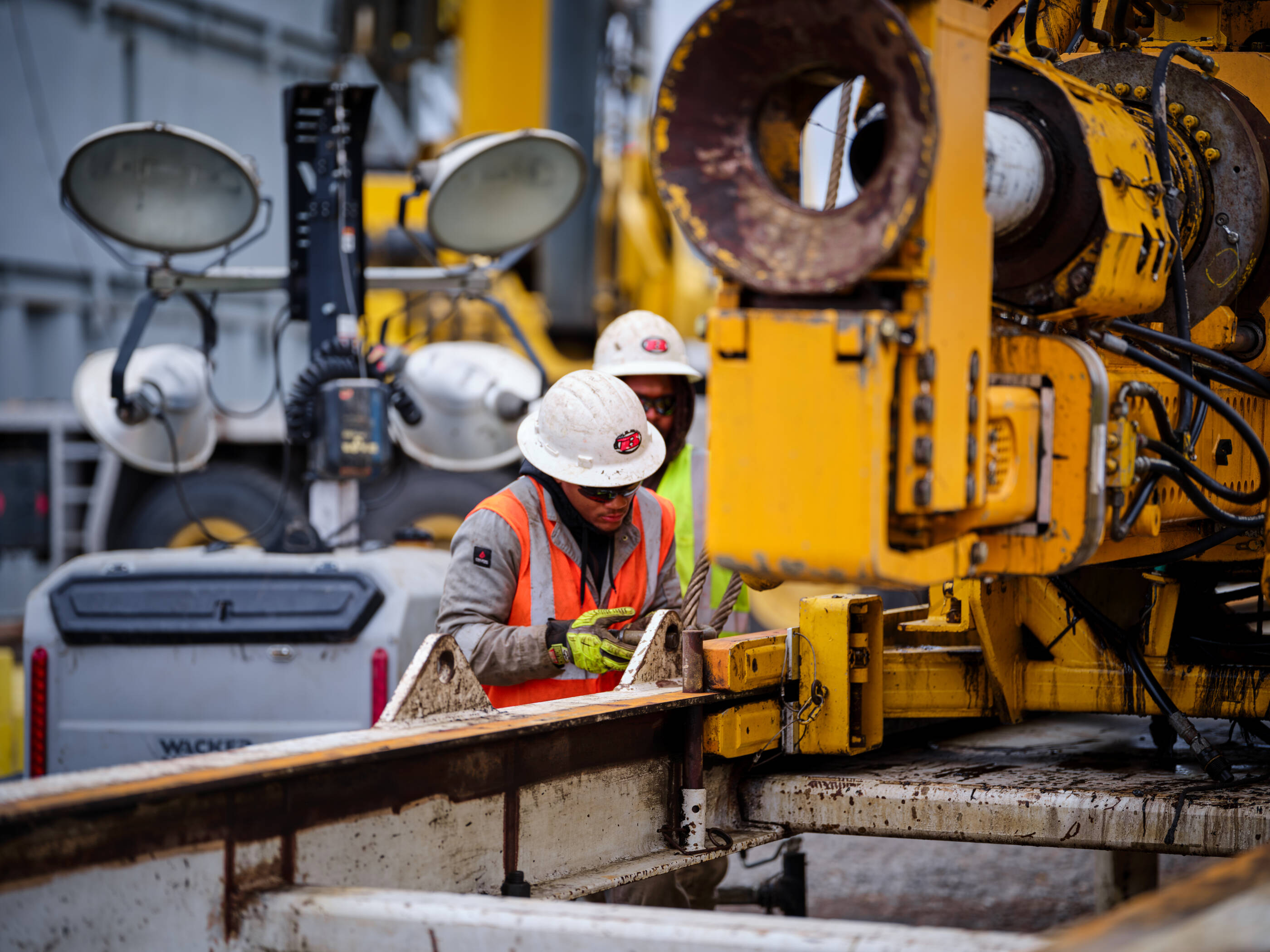 Workers working on lithium well wearing safety gear