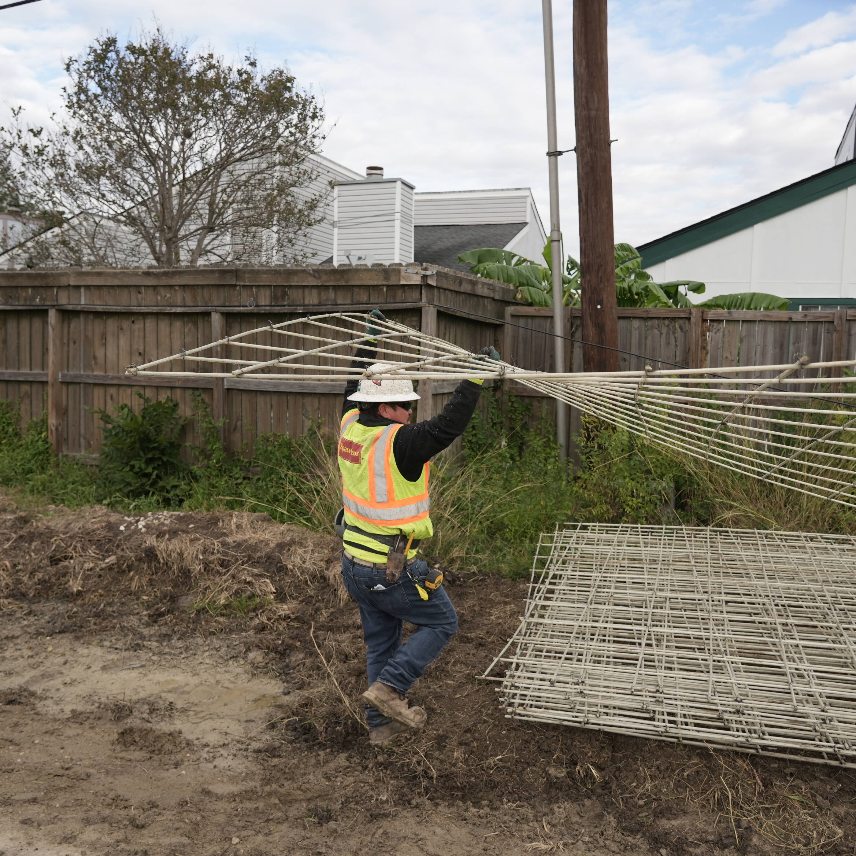 Man carrying rebar 